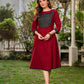 Chic maroon dress featuring a contrasting teal neck patch with charming Peter Pan collar details