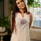 Off-white dress featuring intricate Madhubani artwork and a maroon Mandarin collar.