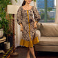 Heritage Kalamkari dress with elegant mustard accents and black pearl embellishments.
