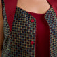 Sharp dark teal and maroon checkered sleeveless jacket with a distinctive notch collar and princess-cut tailoring, offering a structured silhouette ideal for elevated corporate styling.