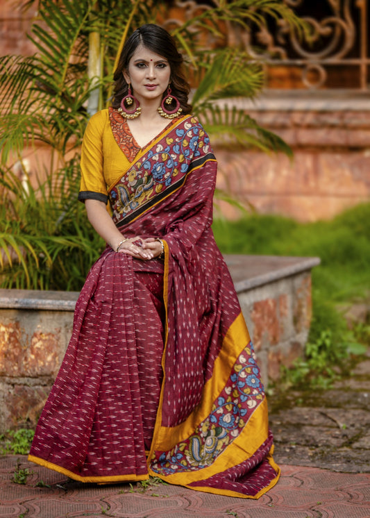 Exclusive maroon ikat saree with hand painted kalamkari border