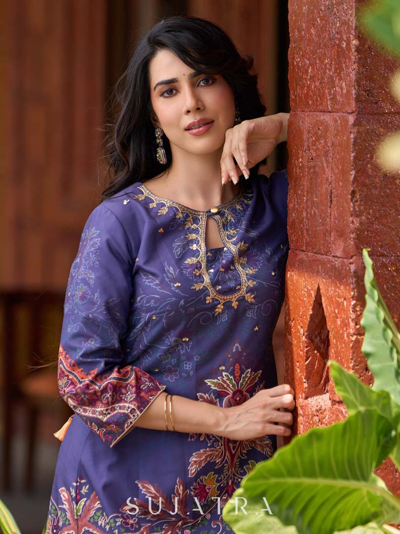 Stunning royal blue printed kurta adorned with handcrafted zardozi and sequin detailing on the keyhole neck.