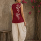 Charming red hand block print top showcasing elegant floral motifs, a contemporary pleated silhouette, and refined detailing, blending artisanal craftsmanship with effortless everyday style.