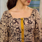 Heritage Kalamkari dress with elegant mustard accents and black pearl embellishments.
