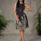 Black digital printed sleeveless dress with straight printed strip neckline and beige accents
