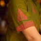 Gorgeous olive dress with pink abstract triangle hand block prints placed at the centre, sleeves, and back, featuring a mandarin collar and half sleeves for a refined, contemporary look.