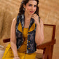Tailored black Kantha jacket featuring fish motifs, a mustard pintuck patch, and a flipped collar, offering a structured silhouette with refined detail and distinctive, contemporary character.