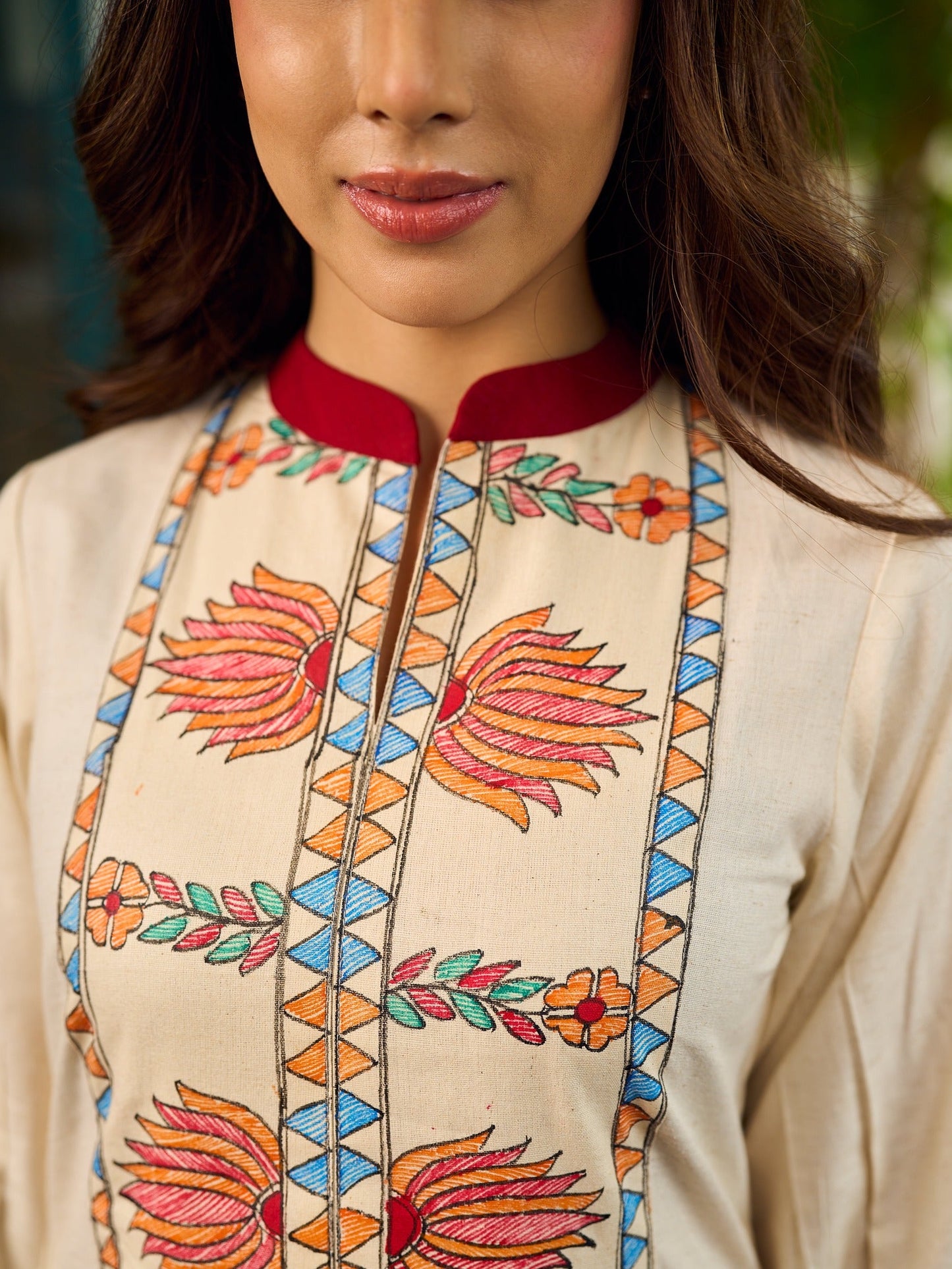 Artisan-crafted off-white Madhubani dress with beautiful hand-painted motifs and trim.