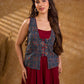 Handcrafted Ajrakh sleeveless jacket featuring front flaps, maroon detailing, breathable fabric, and a contemporary ethnic fusion appeal.