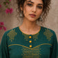 Enchanting bottle green tunic featuring a refined, rhythmic Block print motifs, vibrant mustard accents, and a graceful aesthetic.