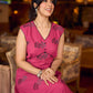 Rich wine drop-shoulder dress with black and grey hand block printed floral motifs, a softly gathered yoke, black pearl embellishments, and bold black accents for a striking artisanal look.