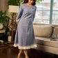 Two-tone handloom cotton dress with delicately painted Madhubani fish motifs and pleated hem.