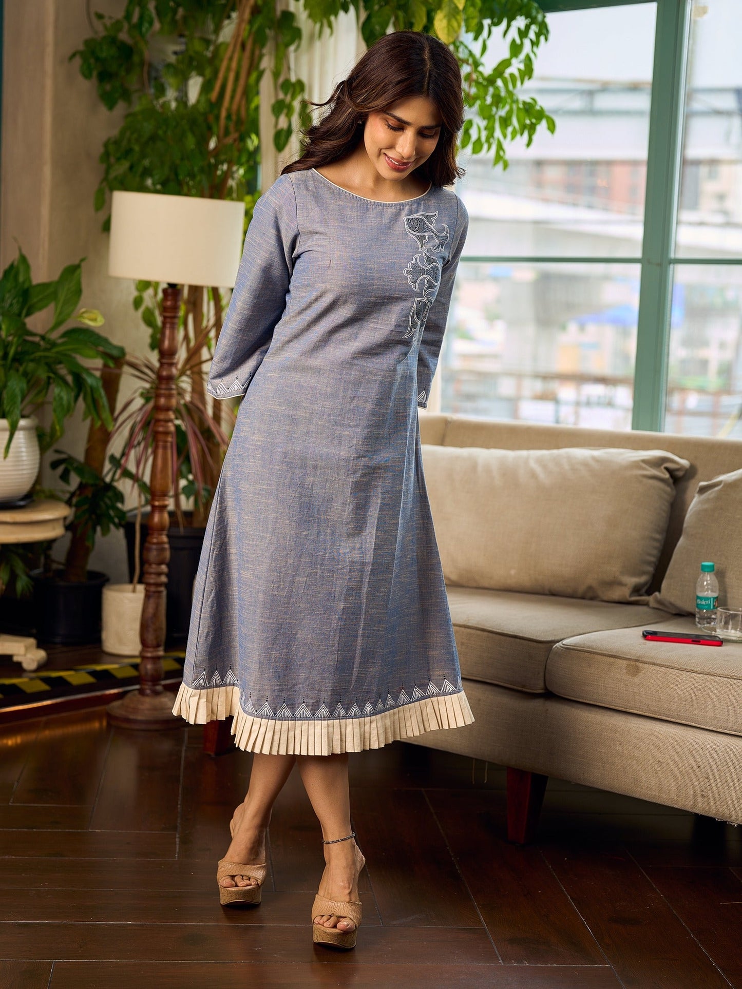 Two-tone handloom cotton dress with delicately painted Madhubani fish motifs and pleated hem.