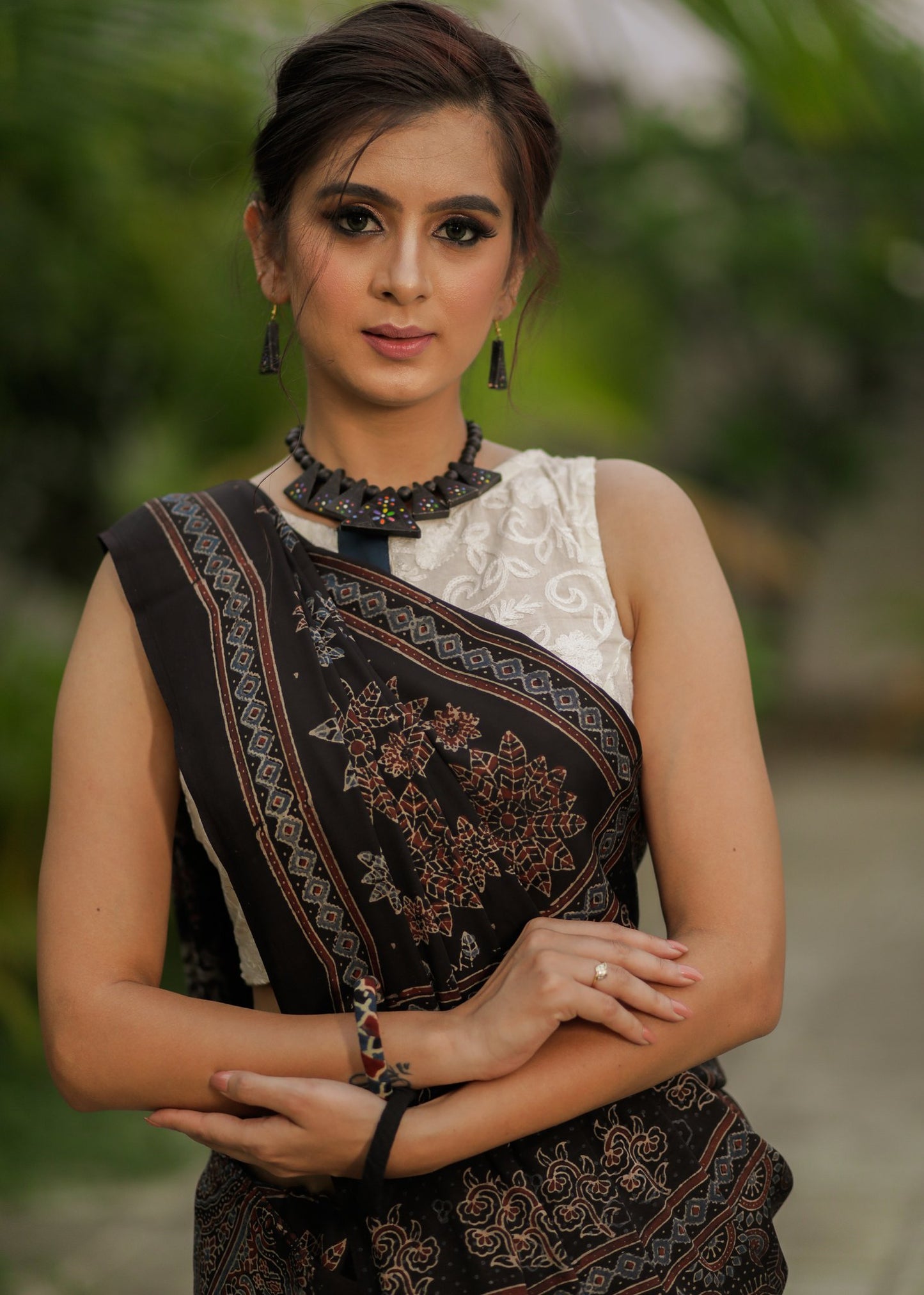 Pure modal silk ajrakh block printed black designer saree with floral motifs