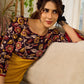 Mustard Kalamkari dress with an asymmetrical yoke and puffed sleeves.