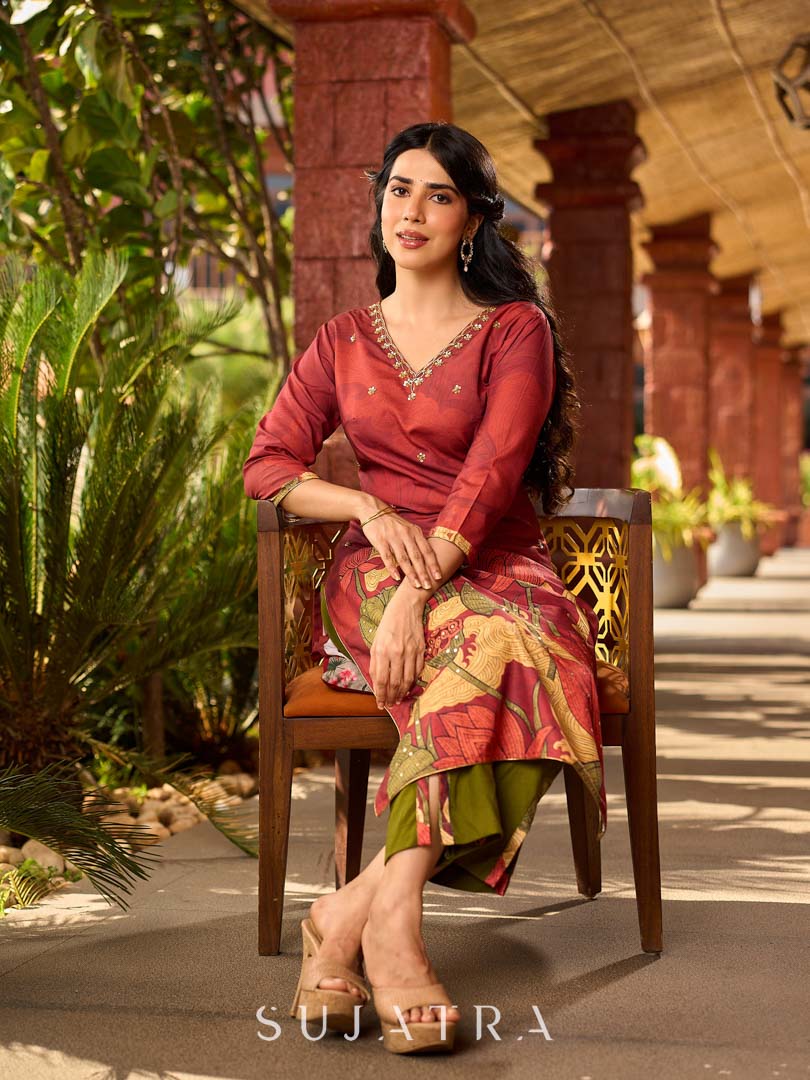 Classic deep rustic maroon kurta with detailed hand embroidery, statement olive and cream Pichwai artwork, and rich gold highlights