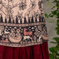 Beige traditional printed dress with rich maroon accents.
