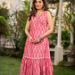 Graceful pink Ikat long dress accented in white, designed with gathered detailing at the fall and a clean sleeveless finish