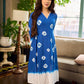 Refreshing cobalt blue shibori tie-dye dress with ivory accents and delicate lace-trimmed neckline.