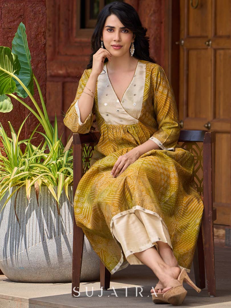 Exquisite yellow Bandhani printed kurta with a delicate off-white tissue overlay and refined accents.