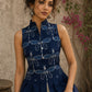 Contemporary indigo top with delicate dragonfly motifs, high folded collar, and graceful pleated hemline.