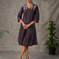 Black Ajrakh printed dress with pleats, maroon accents, and silver embellishments.