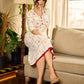 Soft off-white block printed rayon dress with intricate all-over hand block printed checks and florals, a gently gathered yoke, and rich red accents for a refined, elegant everyday look.