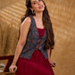 Handcrafted Ajrakh sleeveless jacket featuring front flaps, maroon detailing, breathable fabric, and a contemporary ethnic fusion appeal.