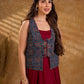 Handcrafted Ajrakh sleeveless jacket featuring front flaps, maroon detailing, breathable fabric, and a contemporary ethnic fusion appeal.