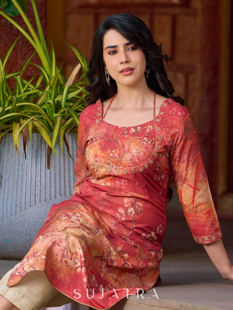 Amber crimson blossom printed kurta with golden pearl handwork on the yoke and dainty tie-up neck details.