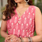 Graceful pink Ikat long dress accented in white, designed with gathered detailing at the fall and a clean sleeveless finish