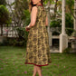 Graceful natural-printed halter dress elevated with subtle maroon highlights.