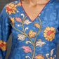 Indigo Kalamkari printed dress with vibrant red and mustard accents.