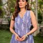 Graceful powder blue Ikat dress showcasing layered overlap details highlighted with white accents.