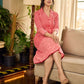 Peach and red block print stripe-floral shirt dress with fusion hand block printed stripes and jaal, a notch collar, and coordinated red accents for a vibrant, contemporary look.