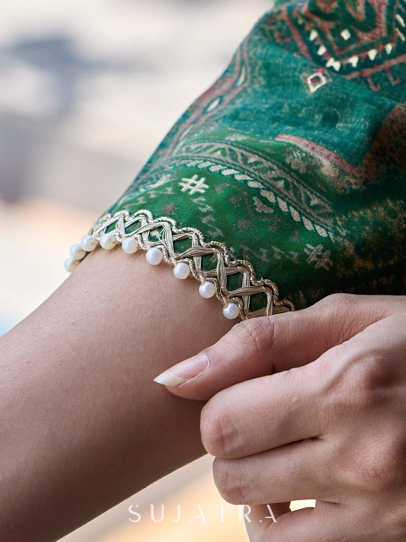 Rich bottle green printed Angrakha with a finely hand-embroidered neckline and soft beige accents.