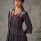 Black Ajrakh printed dress with pleats, maroon accents, and silver embellishments.