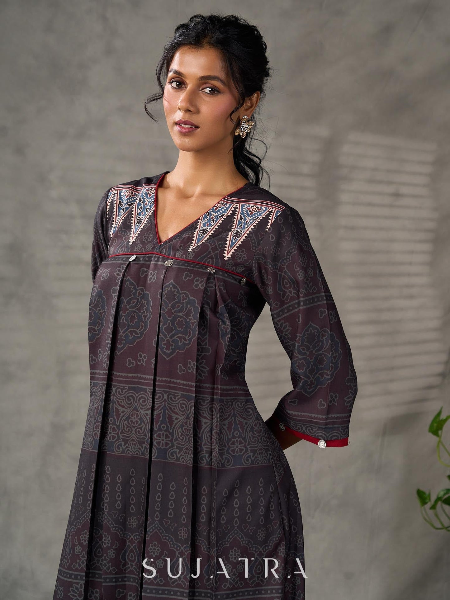 Black Ajrakh printed dress with pleats, maroon accents, and silver embellishments.