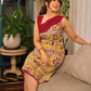 Elegant cream and maroon Madhubani dress featuring sophisticated wavy pintuck flap detailing.
