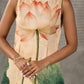 Statement Cream lotus motif dress with earthy olive accents.