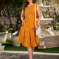 Statement mercerised mustard Ikat dress elevated with drop-shoulder styling, pleated neckline and sleeves detailing featuring soft box pleats for ease and movement