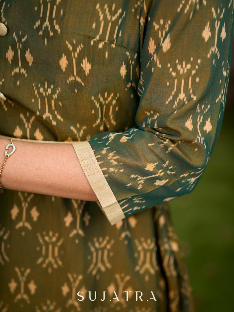 Statement olive green two-tone Ikat dress elevated with cream?gold accents, a structured belt for definition, and a subtle left-front slit.