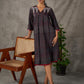 Black Ajrakh printed dress with pleats, maroon accents, and silver embellishments.