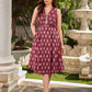 Statement maroon Ikat sleeveless dress elevated with pintuck detailing through the bodice and box pleats beyond the darts for a soft, flowing finish.