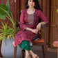 Exquisite deep burgundy printed kurta with intricate neck panel embroidery, delicate green beads, and refined green highlights.