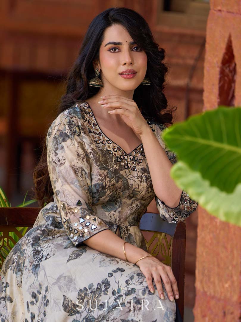Elegant black–white floral kurta featuring a graceful bias silhouette, intricate mirror embroidery on the neck and sleeves, and a sweetheart neckline.