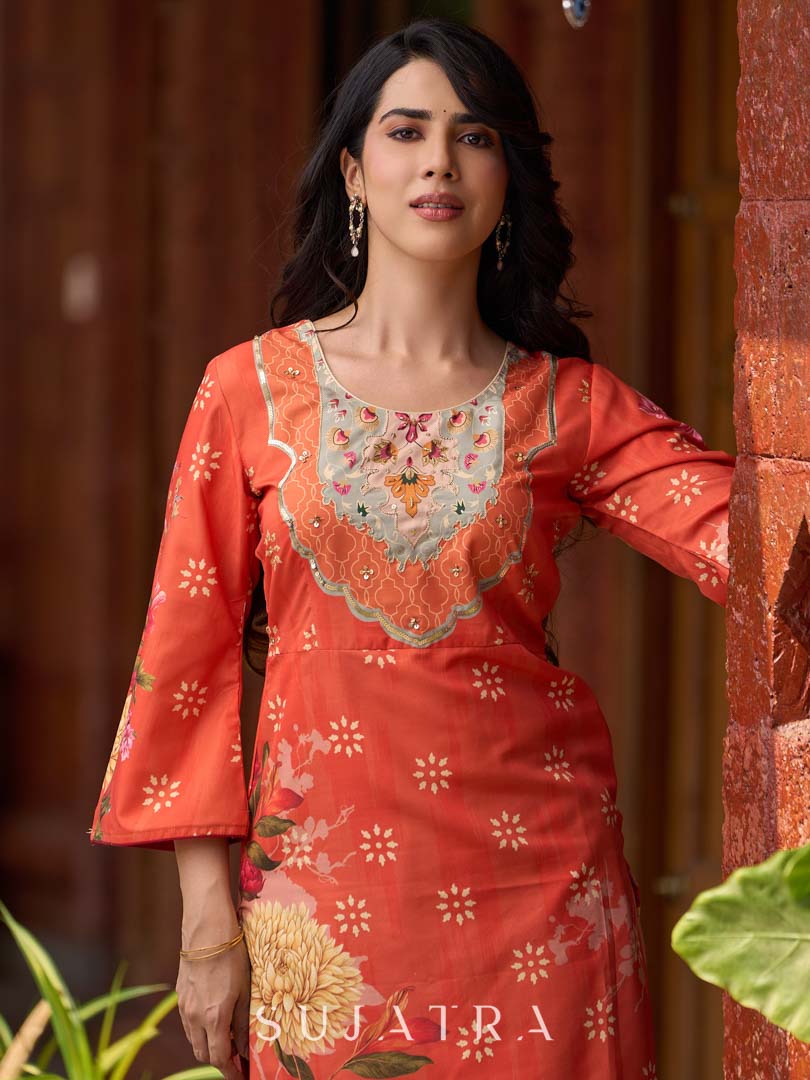Elegant orange floral printed kurta with hand-embroidered sequin and cut dana detailing on the yoke and rich maroon accents.