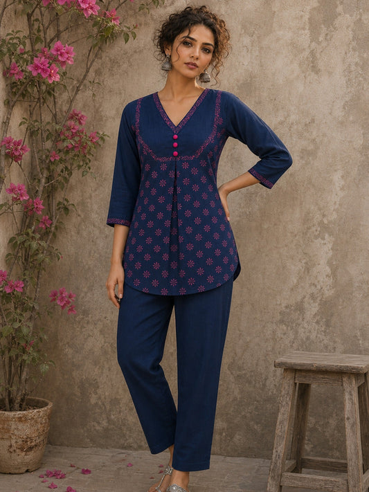 Vibrant navy blue and pink hand block print top features bell sleeves, floral detailing, and rich navy hues for effortless everyday charm.