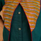 Sophisticated bottle green and mustard Ikat jacket featuring an overlapping neckline closure, front-open design, and rich maroon accents, offering a composed, tailored silhouette for corporate wear.