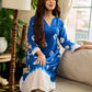 Refreshing cobalt blue shibori tie-dye dress with ivory accents and delicate lace-trimmed neckline.